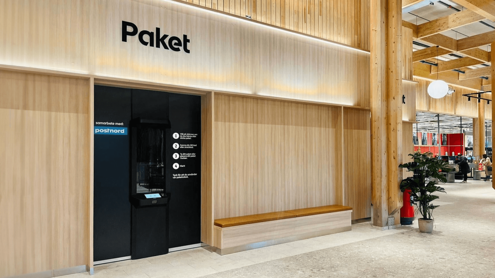 Cleveron 402 robotic parcel locker in ICA store behind a wall, only the intuitive black console is visible, providing access for package deposits and retrievals